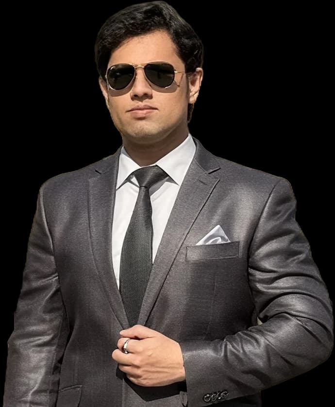 Mohammed Omer Ejaz, co-founder and CEO of SensViz, in a charcoal suit and aviator sunglasses